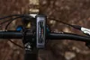 A bicycle handlebar with an OSRAM front light mounted on it, set against a blurred natural background. Anteprima dell’immagine prodotto