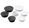 A collection of black and white desk cable grommets arranged on a white background. Náhled obrázku produktu