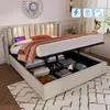 A beige upholstered bed with its storage compartment open, revealing stored items. The bed has a tufted headboard with integrated lighting. Náhled obrázku produktu