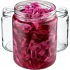 A close-up shot of a glass jar filled with pickled red cabbage, with two empty glass jars in the background. Voir les images du produit