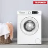 A white Telefunken washing machine is shown in a room with a laundry basket filled with towels and a peach-colored towel next to it. Produktbild-Vorschau