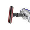 A close-up shot of a vacuum cleaner attachment and part of the vacuum cleaner body, isolated on a white background. Produktbild-Vorschau