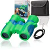 A pair of green and blue children's binoculars with a carrying case, cleaning cloth, and neck strap, along with the product packaging. Náhľad obrázku produktu