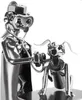 A metal figurine of a veterinarian examining a dog. Náhľad obrázku produktu