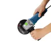 Hands holding a blue and silver angle grinder with a black disc. Náhled obrázku produktu