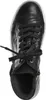A top-down view of a black leather sneaker with laces. Produktbild-Vorschau