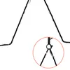 A close-up view of a black metal star decoration with integrated warm white LED lights, showing a detail of the hanging mechanism. Anteprima dell’immagine prodotto