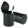 A black car ashtray with a cigarette in it, and another ashtray in the background. Náhled obrázku produktu