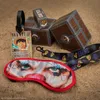 A collection of One Piece themed merchandise laid out on a sandy surface. Produktbild-Vorschau