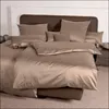 A neatly made bed with taupe colored bedding. Produktbild-Vorschau