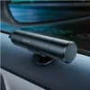 A black Baseus safety hammer with a seatbelt cutter is mounted on the interior door panel of a car. Náhľad obrázku produktu
