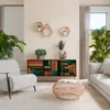 A modern living room with a sideboard, armchair, and sofa. Anteprima dell’immagine prodotto