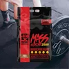 A bag of protein powder is placed on a gym floor next to a barbell and weight plates, with a person's legs and feet visible in the background. Produktbild-Vorschau