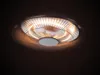 A close-up, low-angle view of a ceiling-mounted heater with glowing heating elements. Anteprima dell’immagine prodotto