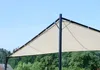 A close-up view of a beige garden pavilion roof structure against a clear blue sky and green trees. Produktbild-Vorschau