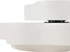 A close-up side view of a white, layered product. Voir les images du produit