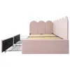 A side view of a pink upholstered bed frame with two drawers pulled out, revealing the slatted mattress support. Podgląd zdjęcia produktu