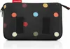 A black toiletry bag with colorful polka dots. Produktbild-Vorschau