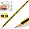A hand holding a pencil drawing a lighthouse and other structures. The pencil is shown in detail, with a close-up of its markings and a sharpened tip drawing a line. Voir les images du produit
