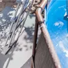 A close-up view of a ladder and the edge of a pool. Produktbild-Vorschau