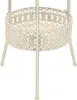 A close-up view of a white metal bistro table with a decorative, heart-patterned edge. Anteprima dell’immagine prodotto