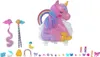 A collection of Polly Pocket toys, including a unicorn-shaped playset and various accessories, laid out on a white background. Produktbild-Vorschau