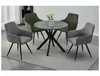 A dining table with four chairs on a rug. Produktbild-Vorschau