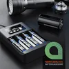 A black battery charger with four AA batteries inserted, a flashlight, and a spare battery are displayed on a black surface. Anteprima dell’immagine prodotto