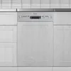 A front view of a silver and gray dishwasher integrated into a kitchen cabinet. Produktbild-Vorschau