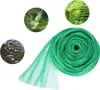 A roll of green bird netting is shown, with three circular insets demonstrating its uses: protecting a bird from a net, protecting grapes from birds, and showing leaves caught in a net over water. Produktbild-Vorschau