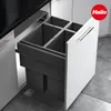 A pull-out kitchen bin system with four compartments, integrated into a white cabinet. Produktbild-Vorschau