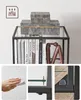 A collage showing a shelf unit with books and decorative items, along with close-ups of its features and cleaning instructions. Voir les images du produit