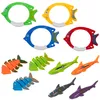 A collection of colorful diving toys shaped like fish and sharks, arranged on a white background. Anteprima dell’immagine prodotto