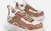 A pair of beige and brown Buffalo sneakers with white fluffy lining, shown against a white background. Podgląd zdjęcia produktu