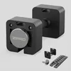 A product shot of adjustable dumbbells and accessories against a plain background. Produktbild-Vorschau