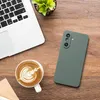 A top-down view of a desk with a laptop, a cup of coffee with latte art, a smartphone, and a small potted plant. Produktbild-Vorschau