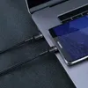 A close-up shot of a black USB-C cable connecting a smartphone to a laptop. Produktbild-Vorschau