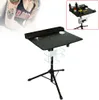 A tattoo workstation on a tripod stand, with a person's tattooed arm visible in the background. Náhled obrázku produktu