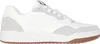 A side view of a white and gray Skechers sneaker with a brown sole. Produktbild-Vorschau