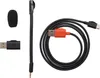 A collection of accessories for a gaming headset, including a microphone, a USB adapter, and a charging cable. Produktbild-Vorschau