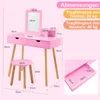 A pink children's vanity table and stool with dimensions indicated by text and lines. Produktbild-Vorschau