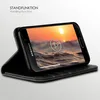 A black flip case for a Samsung Galaxy A3 (2016) phone is shown in a standing position, displaying a video of waves and a sunset. Produktbild-Vorschau