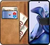 A book-style phone case with slots for cards and cash, open to reveal a smartphone screen. Produktbild-Vorschau