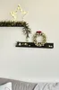 Christmas decorations on shelves mounted on a wall. Produktbild-Vorschau