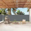 An outdoor patio with furniture and a retractable side awning. Anteprima dell’immagine prodotto