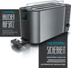 A close-up marketing image of a toaster with text overlays highlighting features. Voir les images du produit