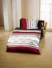 A bed with bedding is shown in a room. Náhled obrázku produktu