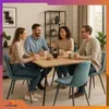 Four people are sitting around a table, enjoying coffee and conversation. Anteprima dell’immagine prodotto
