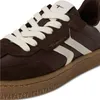 A close-up view of a brown and cream sneaker. Produktbild-Vorschau