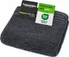 A folded dark gray towel with two tags attached to it. Produktbild-Vorschau